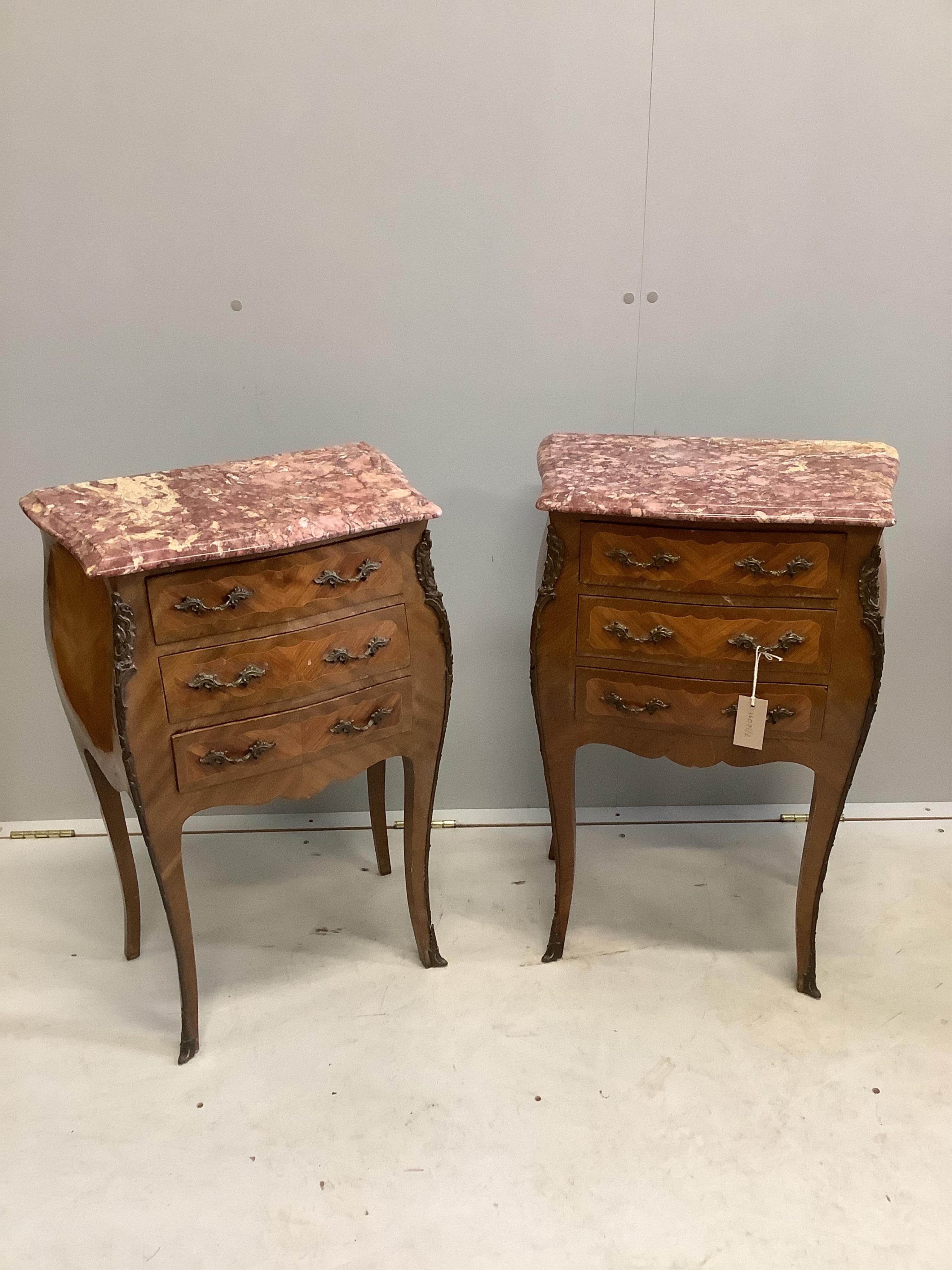 A pair of Louis XVI style kingwood marble top bombe bedside chests, width 48cm, depth 29cm, height 72cm. Condition - fair to good